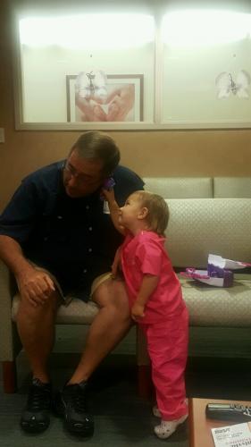 Examining Papi in the waiting room (6/19)